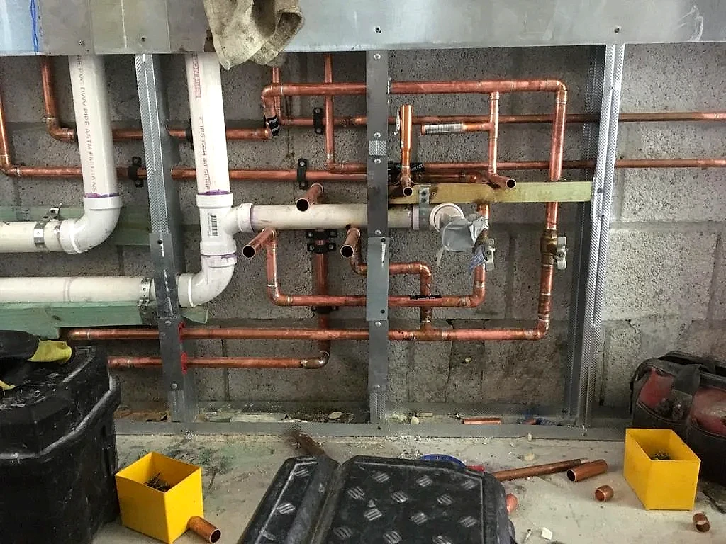 Copper supply and PVC drain rough-in for a bathroom repipe, South Florida