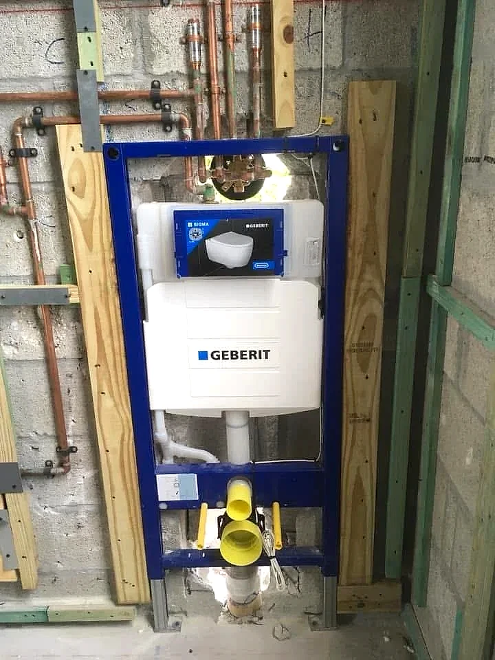 In-wall concealed toilet carrier roughed in with copper supply, South Florida